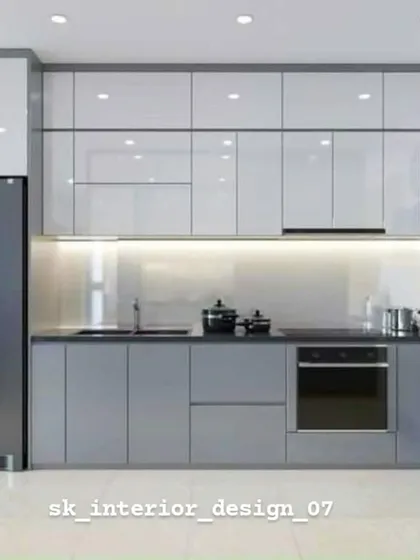 A sleek kitchen in shades of grey with glossy white upper cabinets. The layout is designed for maximum efficiency, with the refrigerator, sink, and oven in a practical work triangle.