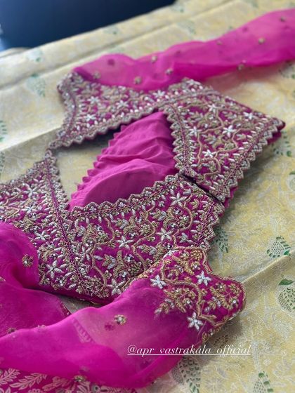 The back of the pink blouse, showing the intricate work continues all around.