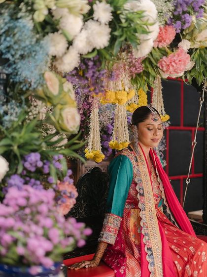 A serene moment captured, with our jewellery adding the perfect touch of sparkle to her colourful outfit.