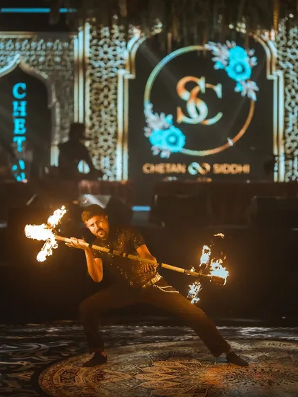 A powerful moment captured during a Sufi-themed wedding. Using a fire dragon staff, I can create dramatic, impactful poses like this that make for incredible photos and memories on your special day.