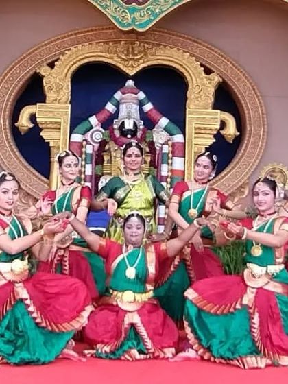 A full group pose at the Naadaneerajanam stage in Tirumala. The grandeur of the stage is matched only by the devotion in our hearts.