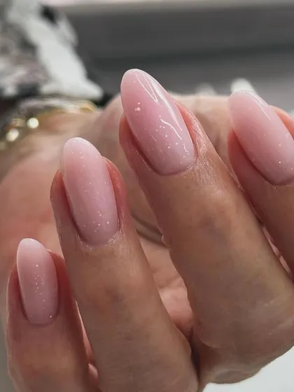 A beautiful "baby boomer" or French ombre manicure. The seamless blend from a soft pink base to a milky white tip is subtle, classy, and very popular.
