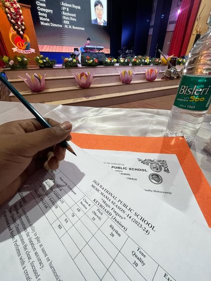 A behind-the-scenes look at the judging process, with our instructor carefully scoring a keyboard performance.