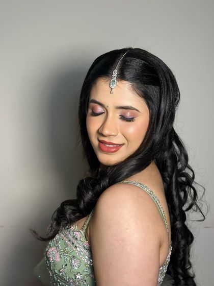 An eyes-closed shot to showcase the soft pink and purple eyeshadow.