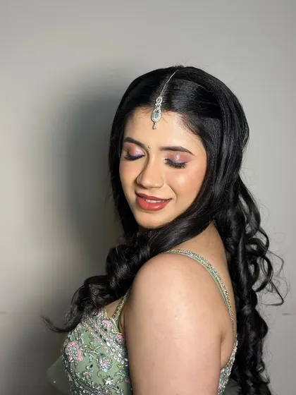 An eyes-closed shot to showcase the soft pink and purple eyeshadow.