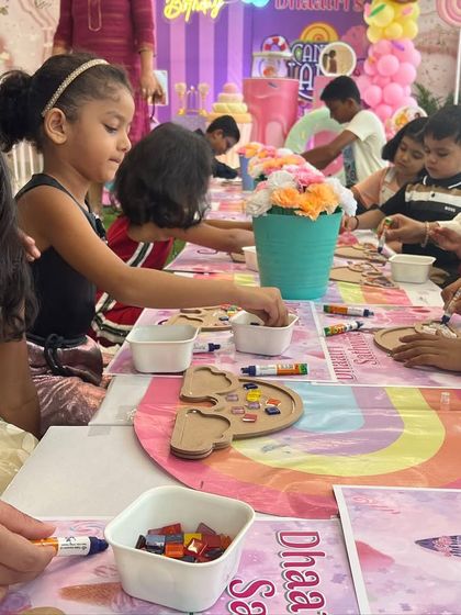 A colorful craft table at a birthday party. I provide all the materials needed for a fun, engaging, and mess-free craft activity for the kids.