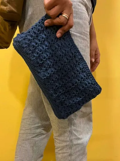 An old clutch that has seen many parties now has a fresh look. I gave it a complete crochet makeover using a deep blue yarn and a textured tulip stitch. It feels so good to reinvent a pyaara old item and get it ready for its next chapter.