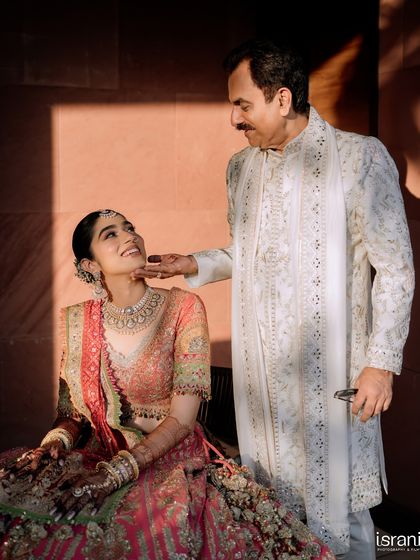 A father's love for his daughter shines through in this touching portrait. These are the family moments that become treasured heirlooms.