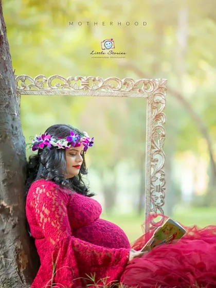 We can build a whole story around your session. Here, we used a beautiful red gown, a floral crown, and a few props to create a scene that feels like it's straight out of a fairytale.