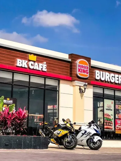 Two superbikes parked outside the Burger King and BK Café, ready for a royal feast. We are a favorite stop for riders looking for quick and tasty food options.