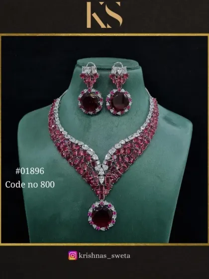 The classic ruby red version of our premium American diamond set. This bold and glamorous piece is perfect for making a statement at a wedding or party.