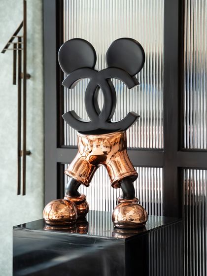 "Chanel Mickey" redefines a pop culture icon through a luxurious lens. Mickey's face is replaced by the Chanel logo, symbolizing the convergence of timeless nostalgia and high-fashion iconography.