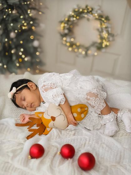Dreaming of reindeer during a two-month Christmas-themed session. I use soft lighting and cozy props to keep your baby comfortable and asleep for these angelic shots.