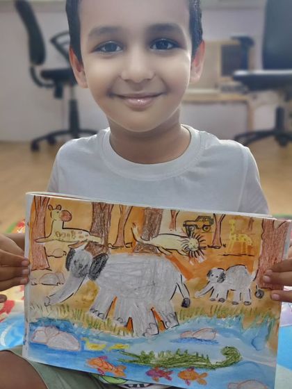 A child's wonderful imagination on display in this jungle scene. An elephant family bathes in a river with fish, while a crocodile, lion, and giraffe coexist peacefully in the background, telling a story of harmony.