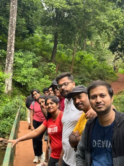 A group selfie on a bridge during our Chikmagalur trip, surrounded by lush forest.