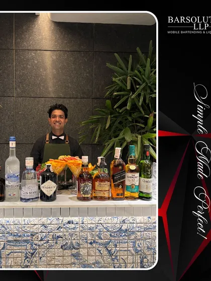 One of our professional bartenders ready to serve at a private celebrity event, with a full selection of premium spirits.