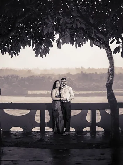 A black and white portrait framed by trees, with the river in the background. This classic composition creates a timeless and romantic image.