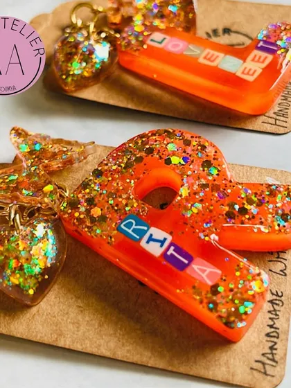 A pair of custom keychains for 'Rita' and 'Loveet'. These matching sets are a great way to celebrate friendship.