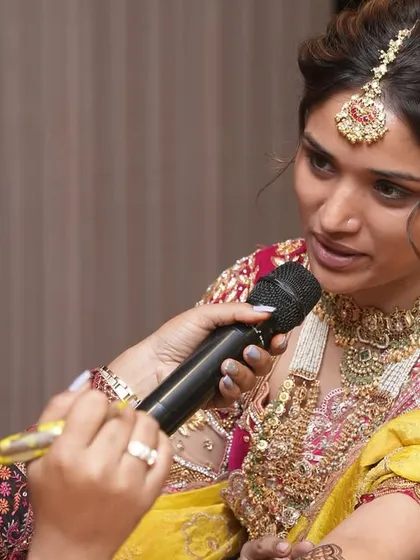 A close-up shot of me applying mehendi on the model during a seminar.