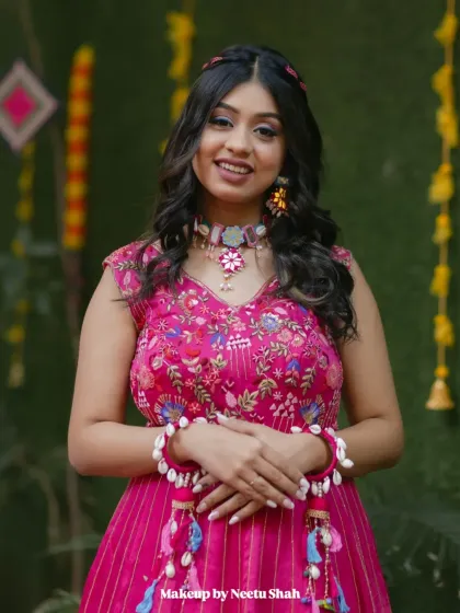 A happy and confident portrait of the bride. The soft glam makeup enhances her features while keeping the look fresh and appropriate for a daytime event.