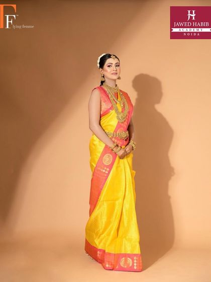A full-length shot of a model in a beautiful South Indian bridal look, created by our students for a professional shoot.