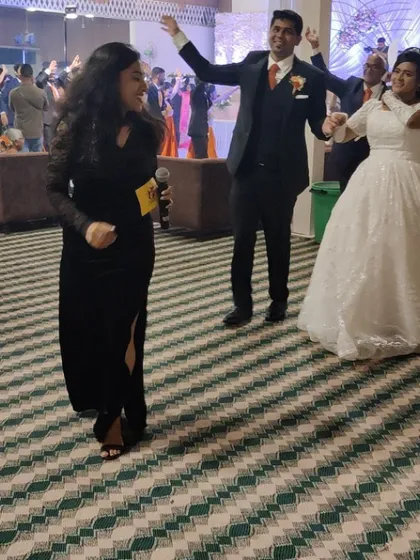 My goal is to keep the dance floor packed and the energy electric. Here, I'm leading the happy couple and their guests at a lively wedding reception, working with the DJ to create a non-stop party atmosphere from the grand entrance to the final song.