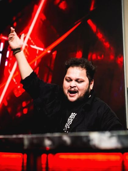 Dropping beats like it's hot. A shot of me in the middle of an intense moment, fully engaged with the music and the crowd.