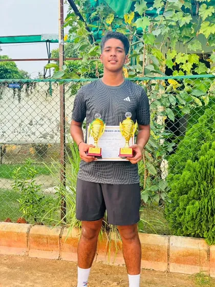 Arjun Bhati celebrating a double win at the CS7 Under-18 tournament, having won both the singles and doubles finals.