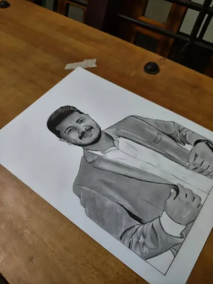An A4 portrait order from Delhi, placed on a wooden table to give a sense of the artwork in a real-world setting.