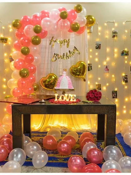 Let us make your loved one's birthday truly special with our indoor balloon and light decoration. This setup features a custom balloon arch, a wall of twinkling fairy lights with photo clips, and a dedicated space for the cake, all designed to create a festive and personal atmosphere.