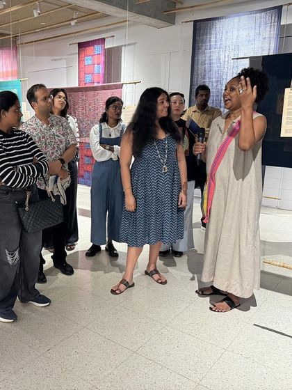 Glimpses from our "We Together Work" exhibition, where hand-printed textiles hang like art. These panels, created with the Bábbarra Women's Centre, tell ancestral stories through the medium of fabric.