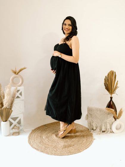 A beautiful full-length shot showcasing her lovely smile and the simple, elegant styling of this boho-chic studio session.