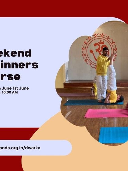 A weekend beginner course in session, with an instructor guiding students through the steps of Sirsasana (Headstand).