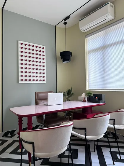 An office should reflect the personality of its user. In my own studio, I designed this private cabin with a vibrant, custom-lacquered pink desk and a bold geometric floor to create an energetic and creative work zone.