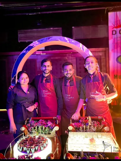 Our team posing with their unique shot-serving trolleys. We are always ready to bring our innovative and interactive services to your event.