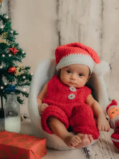The perfect little Christmas scene, with a tiny tree, presents, and our adorable baby Santa.