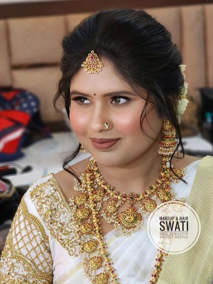 A close-up of Pranali's engagement makeup. The soft brown eyeshadow and nude lip create a sophisticated and modern look.