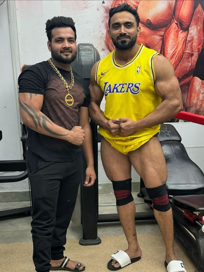 Legs workout done. Posing with a friend.