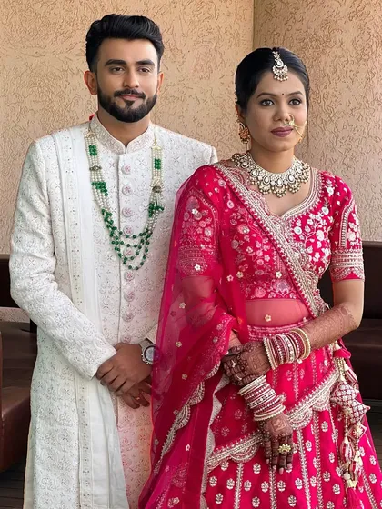 The handsome groom with his beautiful bride.