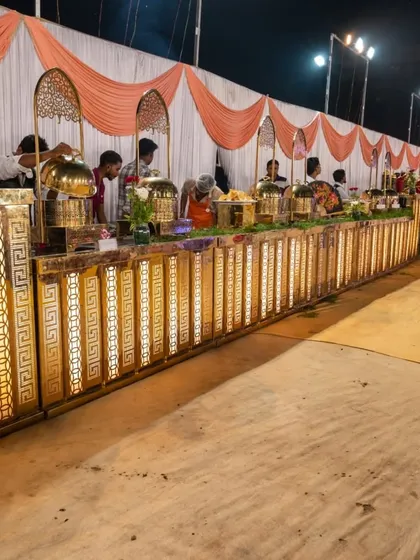 This is our 'Royal' buffet setup, perfect for weddings and grand receptions in the Panvel area. The illuminated counters and elegant decor create a premium dining experience for your guests.