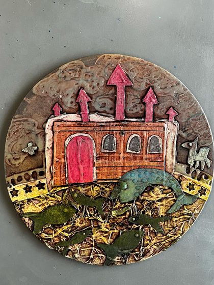 This imaginative collagraph print combines a fantastical castle with a school of fish. The artist used a mix of textures and shapes to build a dreamlike scene, showing the storytelling potential of printmaking.