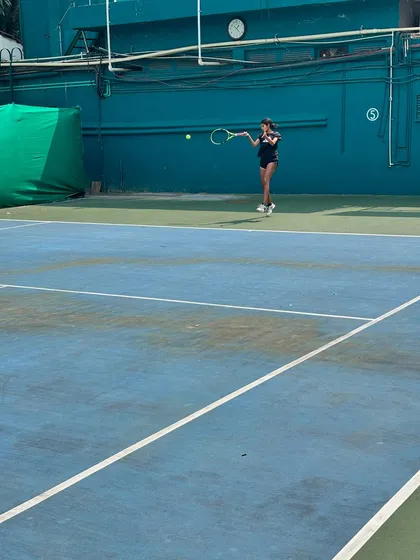 A young player returns a shot during the Inter School Tennis Tournament 2024, an event we proudly helped organize.