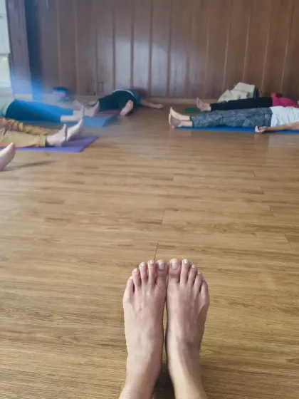 A point-of-view shot from my mat as my students rest in Savasana. This pose is essential for deep rest, releasing stress, and recharging the nervous system.
