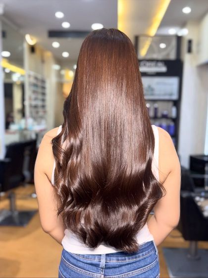 The back view of this sleek Chocolate Global color. The shine is undeniable and the hair looks incredibly smooth.