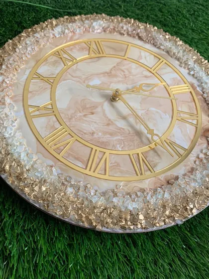 This clock features a beautiful blend of earthy tones with a full border of sparkling gold and white crystals.