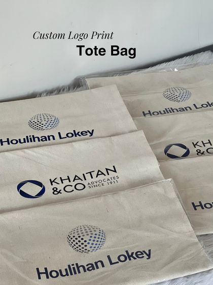 Custom logo printing on canvas tote bags for a corporate event. These bags served as the base for the gift hampers for clients Houlihan Lokey and Khaitan & Co.
