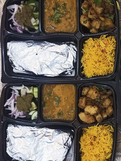 A vibrant and healthy meal with yellow rice, a simple dal, and a dry vegetable preparation. This is a perfect example of a light yet fulfilling lunch option.