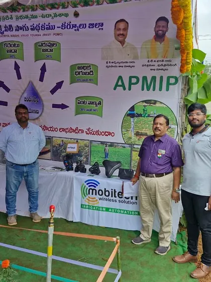 Our team members at the APMIP expo, standing proudly with our display of irrigation automation technology.