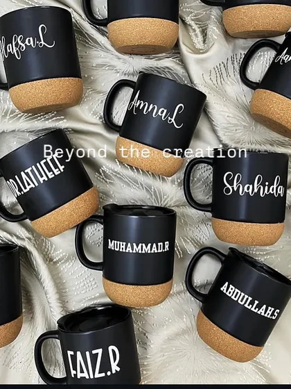 A large batch of our personalised black cork-base mugs, ready for a corporate order. The matte black finish with white script is very chic.