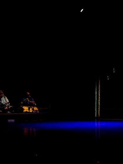 A moment of quiet gratitude on stage with my orchestra in the background. The collaboration between dancer and musicians is the soul of a live performance.